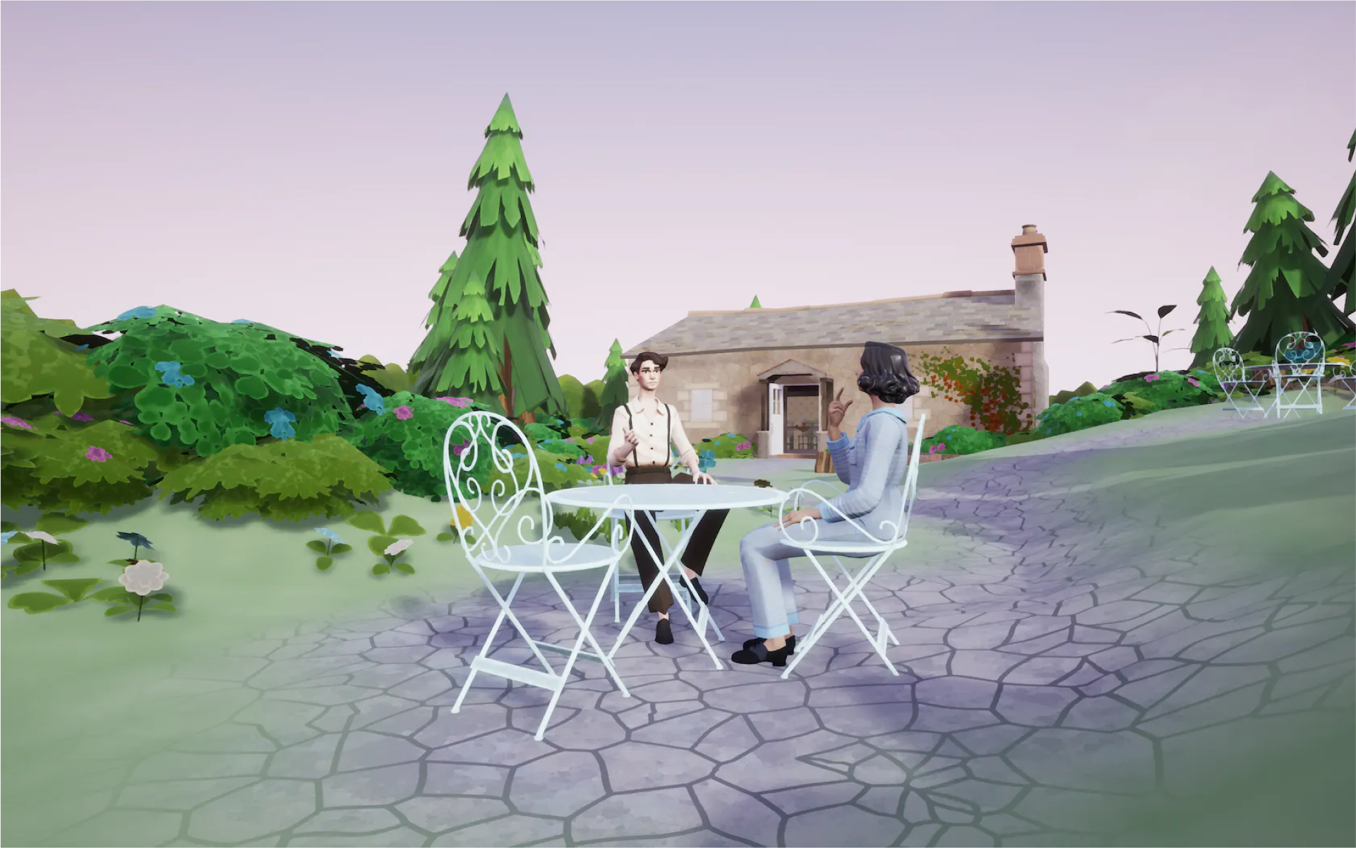 Two people in a garden sitting at a table.